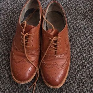 Tan oxfords, worn